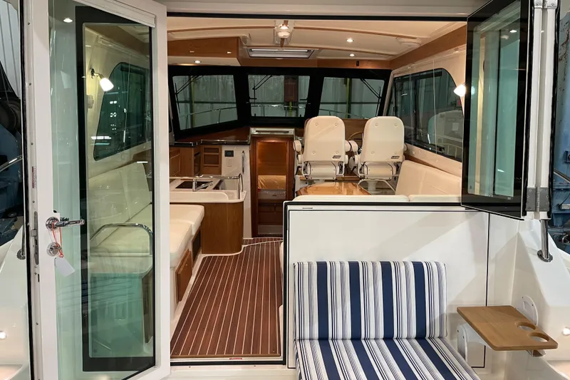 Slide: The Image of Interior view of 2026 Back Cove 372 yacht, featuring elegant seating and modern design. - 6
