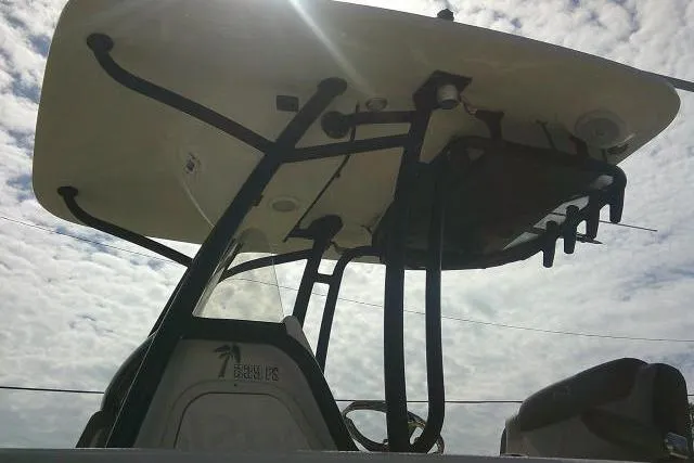Slide: The Image of 2021 Key West 239 FS boat with T-top against cloudy sky. - 12