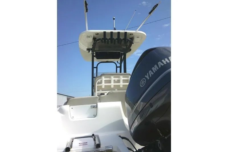 Slide: The Image of 2021 Key West 239 FS boat with Yamaha engine, viewed from the rear. - 13