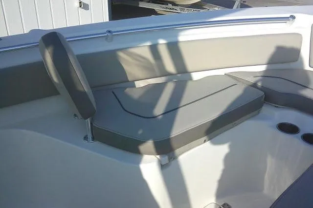 Slide: The Image of 2021 Key West 239 FS boat interior with cushioned seating and cup holders. - 19