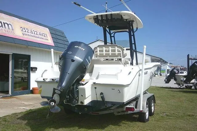 Slide: The Image of 2021 Key West 239 FS boat on trailer, parked outside dealership. - 2