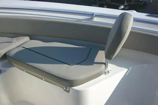 Slide: The Image of 2021 Key West 239 FS boat seating area with gray cushions and backrest. - 20