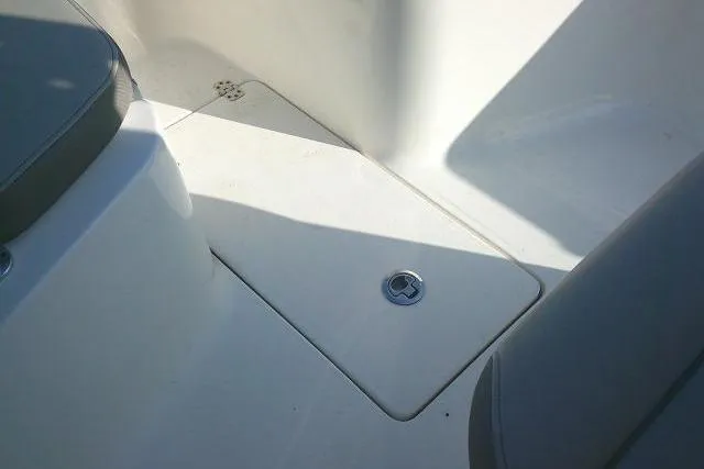 Slide: The Image of 2021 Key West 239 FS boat interior with seating and storage compartment. - 21