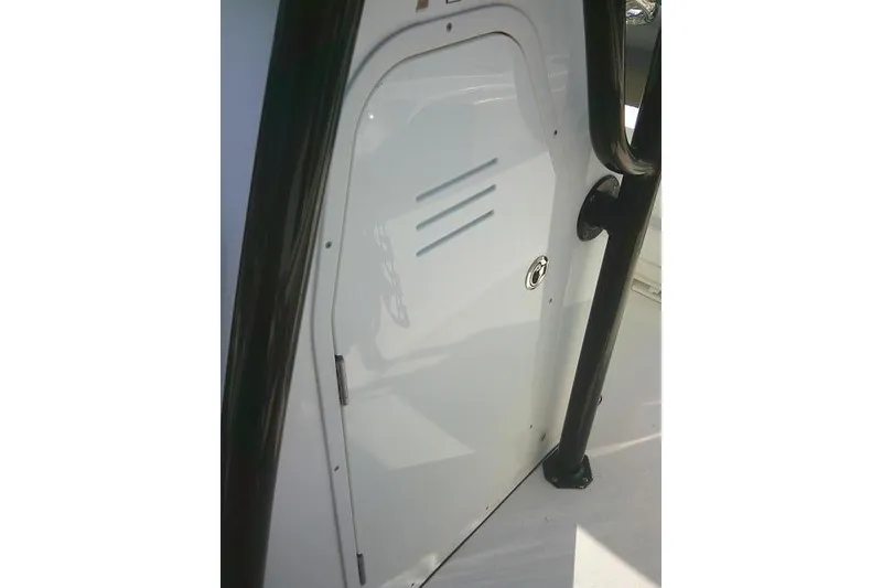 Slide: The Image of 2021 Key West 239 FS boat console door with black handle. - 25