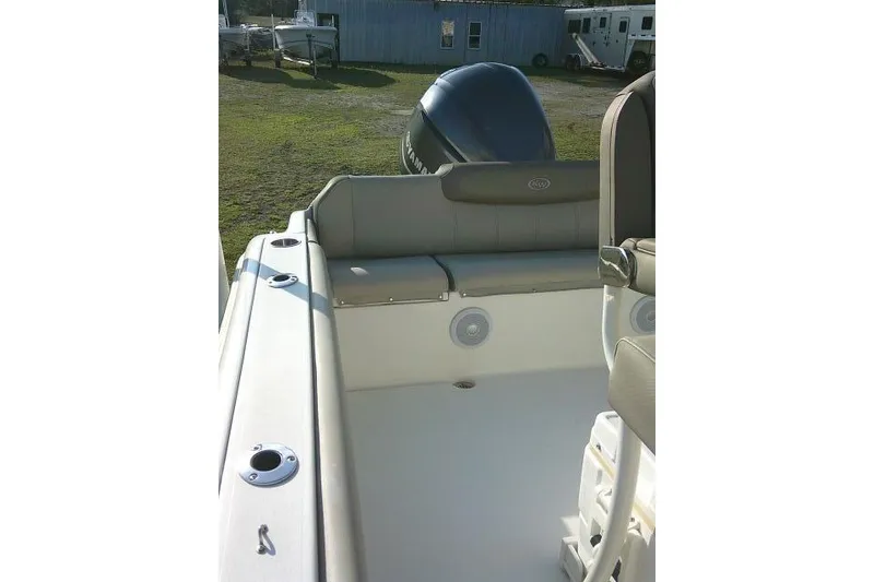 Slide: The Image of 2021 Key West 239 FS boat interior with seating and motor view. - 31