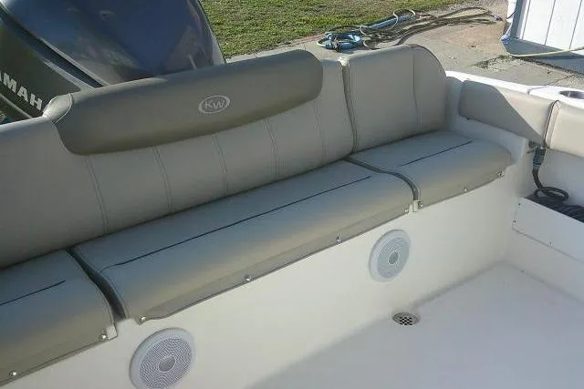 Slide: The Image of 2021 Key West 239 FS boat interior with cushioned seating and built-in speakers. - 32