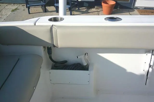 Slide: The Image of 2021 Key West 239 FS boat interior with seating and cup holders. - 33