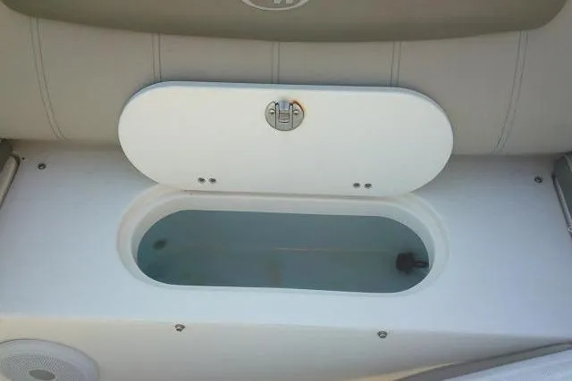 Slide: The Image of 2021 Key West 239 FS boat livewell with open lid, showcasing interior design. - 38