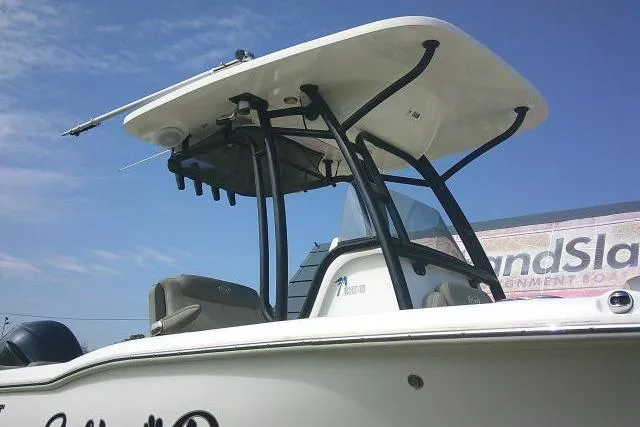 Slide: The Image of 2021 Key West 239 FS boat with T-top against a clear blue sky. - 4