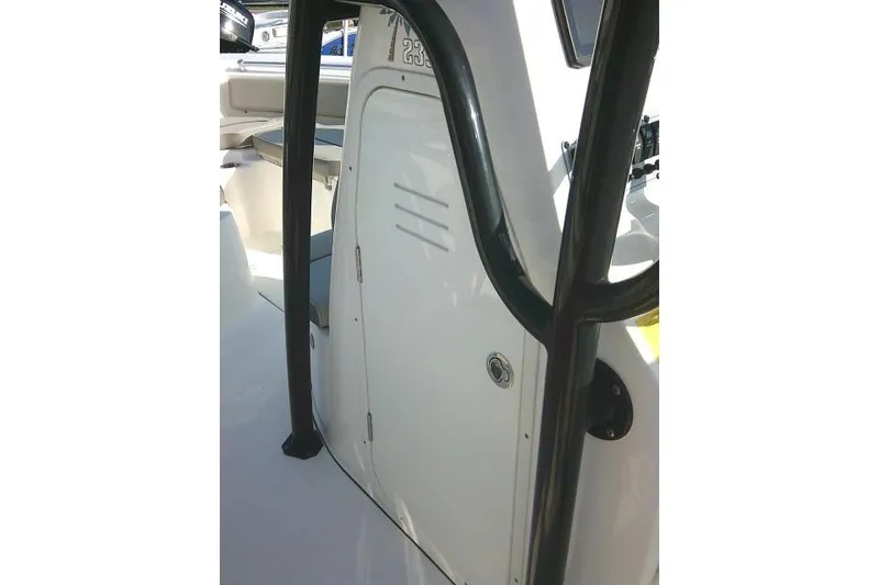 Slide: The Image of 2021 Key West 239 FS boat console with door and black frame. - 40