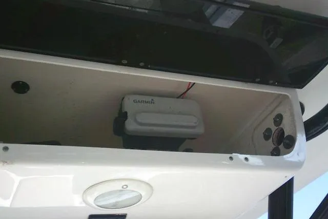 Slide: The Image of 2021 Key West 239 FS boat compartment with Garmin device and wiring. - 43