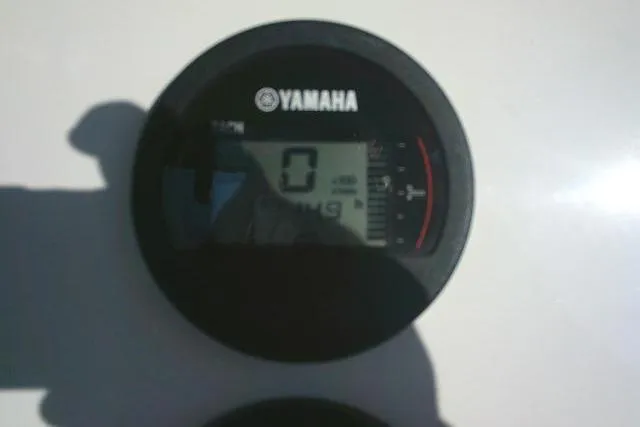 Slide: The Image of Yamaha gauge on 2021 Key West 239 FS boat dashboard, displaying zero reading. - 45