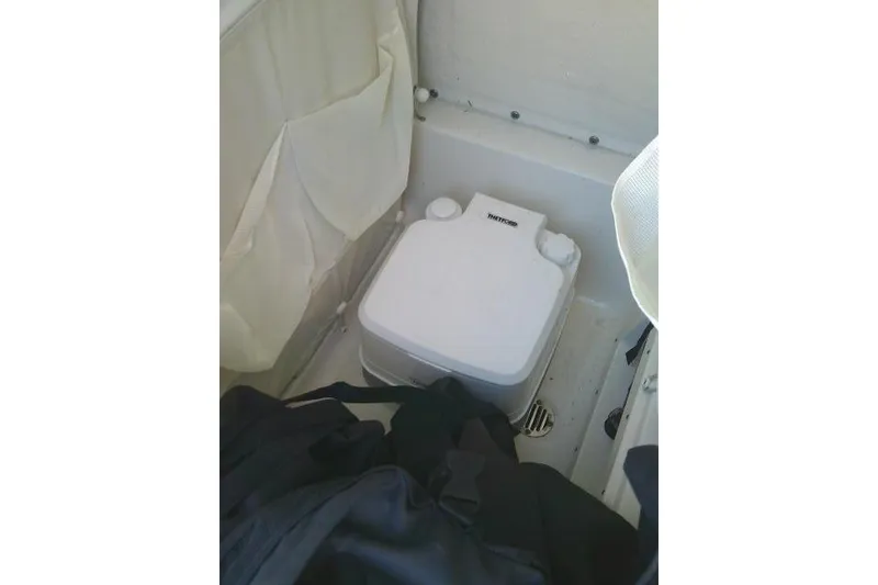 Slide: The Image of Portable toilet on 2021 Key West 239 FS boat, compact and convenient design. - 49