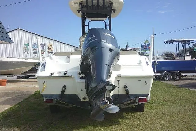 Slide: The Image of 2021 Key West 239 FS boat with Yamaha outboard motor, displayed outdoors. - 5
