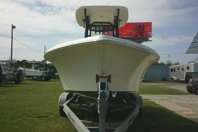 Slide: The Image of 2021 Key West 239 FS boat on trailer, front view, outdoors. - 8