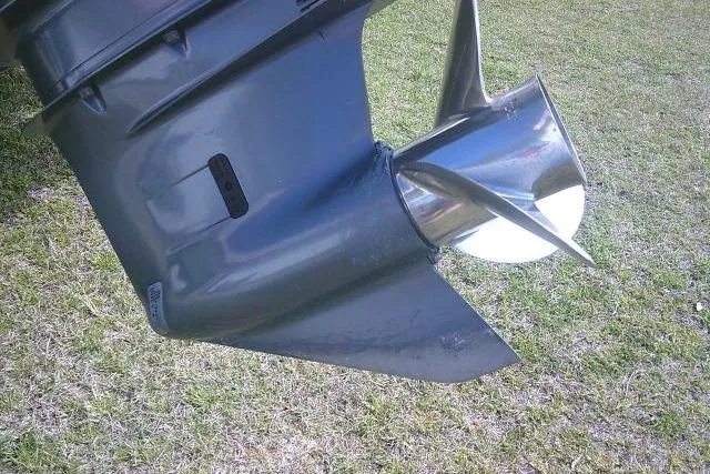 Slide: The Image of 2021 Key West 239 FS boat propeller on grass background. - 9