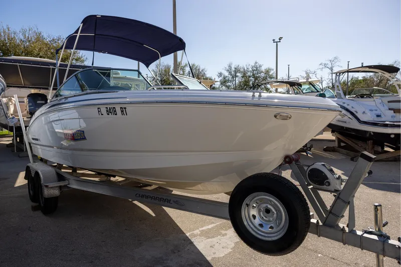 Slide: The Image of 2018 Chaparral 21 H2O Sport OB boat on trailer, parked outdoors. - 4