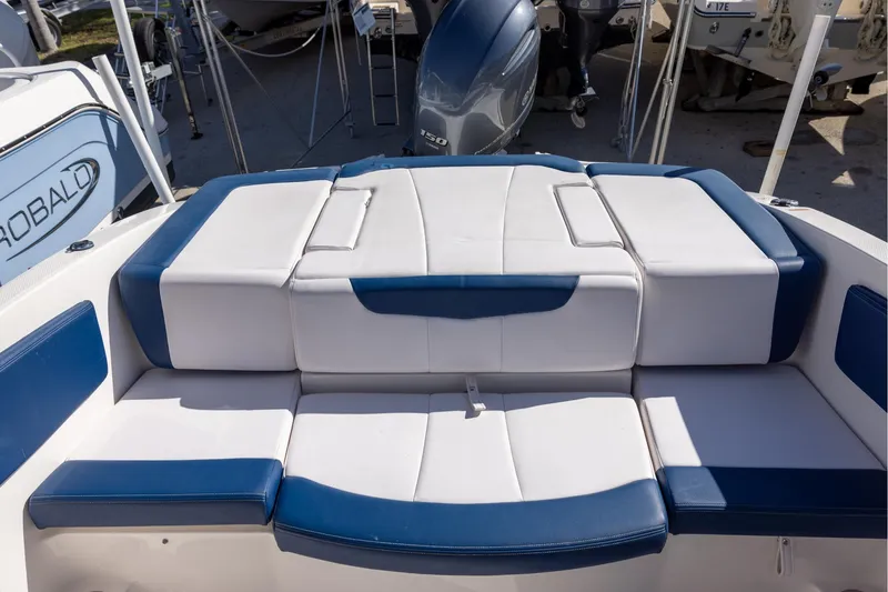 Slide: The Image of 2018 Chaparral 21 H2O Sport OB boat with blue and white seating. - 5
