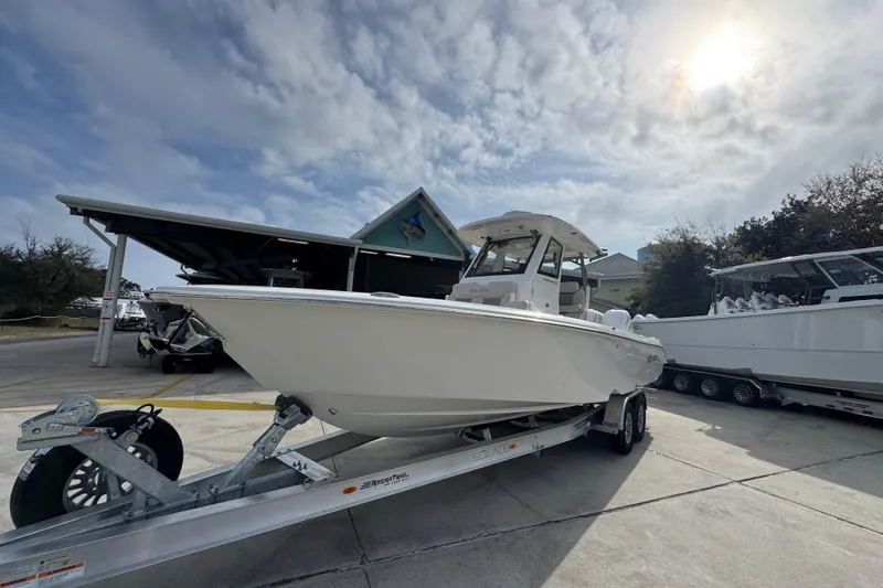 Slide: The Image of 2026 Solace 28 HCS boat on trailer under cloudy sky. - 3
