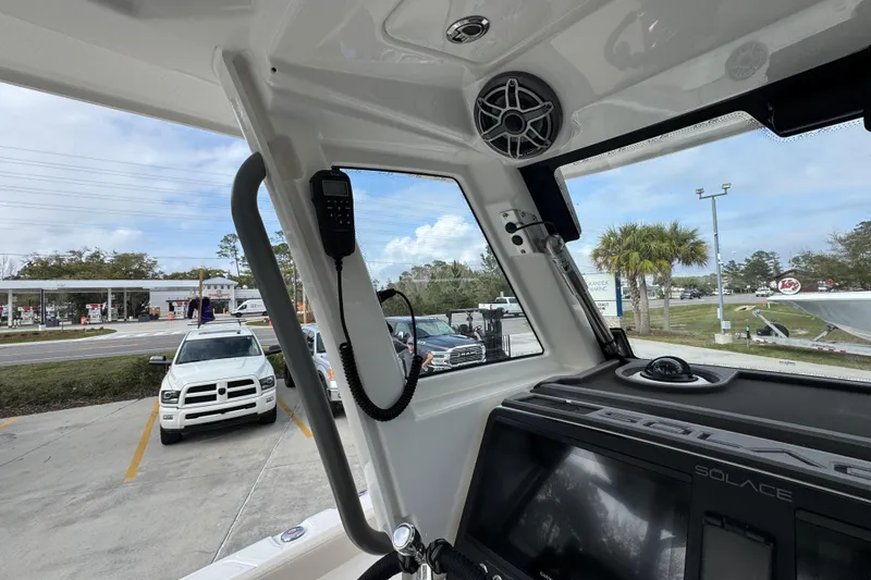 Slide: The Image of Interior view of 2026 Solace 28 HCS boat with dashboard and communication equipment. - 30
