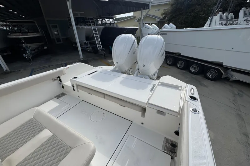 Slide: The Image of 2026 Solace 28 HCS boat with dual engines in a storage facility. - 35