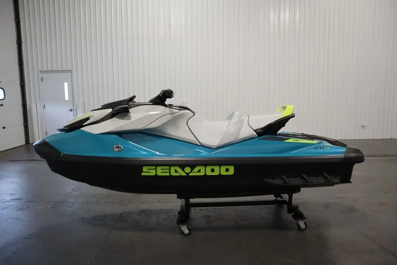 Slide: The Image of 2026 Sea-Doo GTI SE 130 jet ski in a showroom, side view. - 26