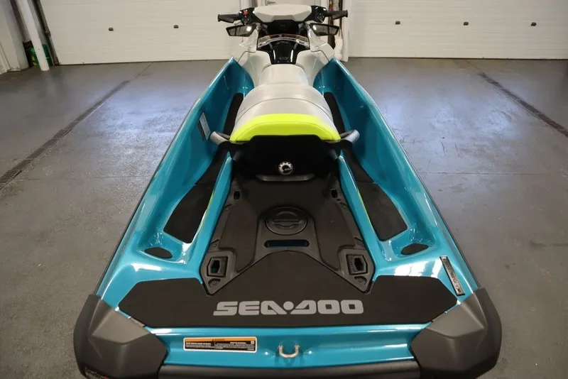 Slide: The Image of 2026 Sea-Doo GTI SE 130 jet ski in a garage, showcasing sleek design and vibrant colors. - 20