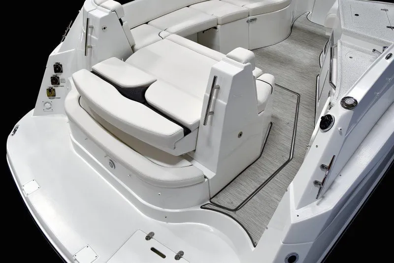 Slide: The Image of Manufacturer Provided Image: 2019 Rinker 320 EX boat interior with white seating and grey flooring. - 13