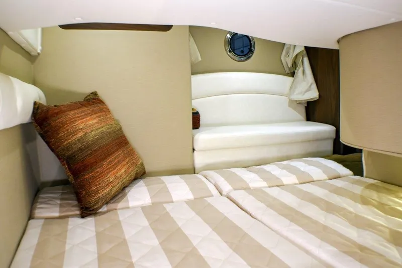 Slide: The Image of Manufacturer Provided Image: 2019 Rinker 320 EX cabin interior with bed and seating area. - 19