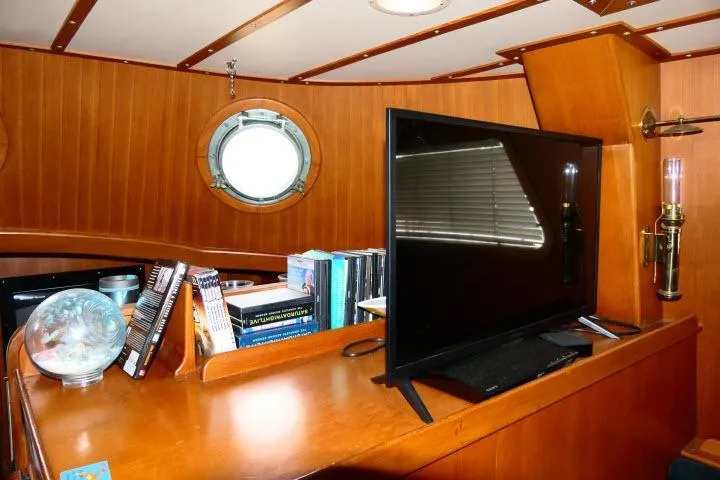 Slide: The Image of Interior of 1982 Ta Shing Mason 63 yacht with wooden cabinetry and nautical decor. - 11