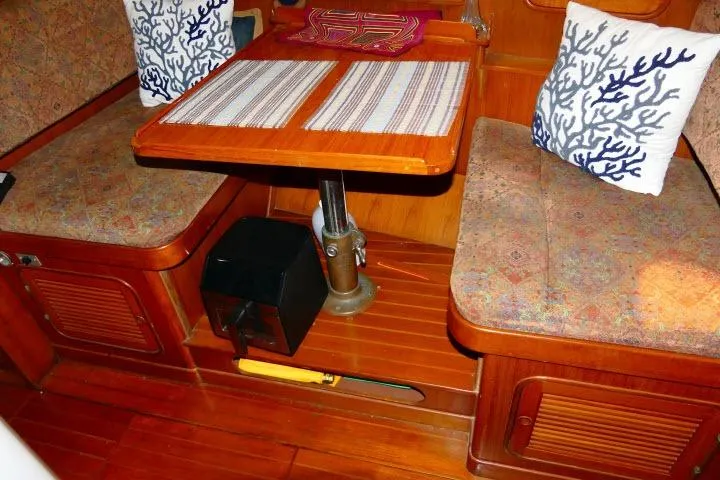 Slide: The Image of Cozy 1982 Ta Shing Mason 63 yacht interior with dining area and nautical decor. - 18