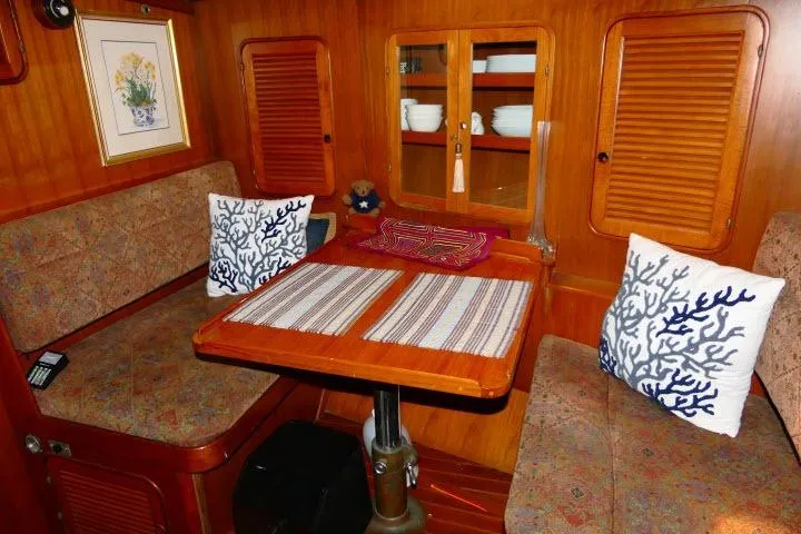 Slide: The Image of 1982 Ta Shing Mason 63 yacht kitchen with wooden cabinetry and compact stove. - 19