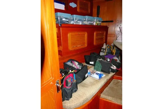 Slide: The Image of 1982 Ta Shing Mason 63 yacht interior with cushions and fire extinguisher. - 30