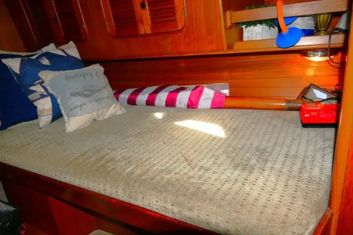 Slide: The Image of Interior of 1982 Ta Shing Mason 63 yacht with wooden cabinetry and ladder. - 32