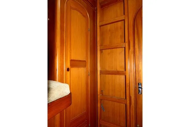 Slide: The Image of Interior of 1982 Ta Shing Mason 63 yacht with cozy wooden bunk beds. - 33