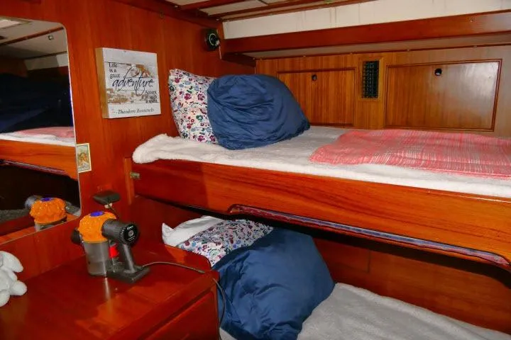Slide: The Image of Interior of 1982 Ta Shing Mason 63 yacht with wooden bunk beds and cozy decor. - 34