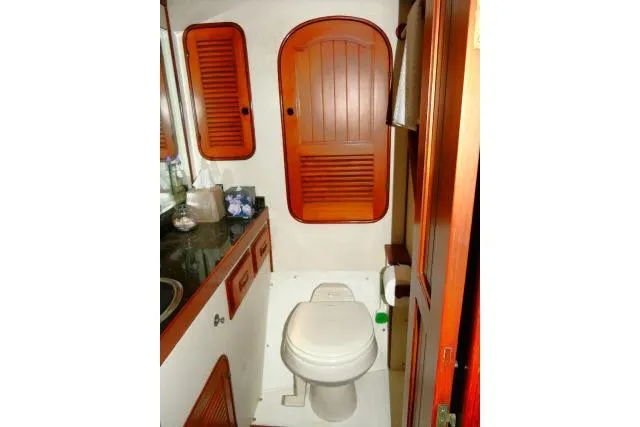 Slide: The Image of Bathroom interior of 1982 Ta Shing Mason 63 yacht with wooden cabinets and stainless steel sink. - 38