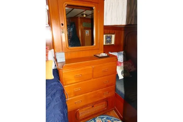 Slide: The Image of Cozy cabin interior of 1982 Ta Shing Mason 63 yacht with wooden furnishings and bedding. - 44