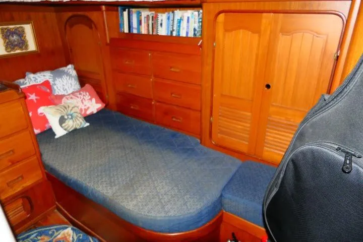 Slide: The Image of Interior of 1982 Ta Shing Mason 63 yacht with wooden cabinets and bookshelf. - 45