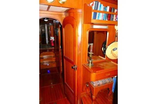 Slide: The Image of Interior of 1982 Ta Shing Mason 63 yacht with wooden cabinetry and bookshelves. - 47