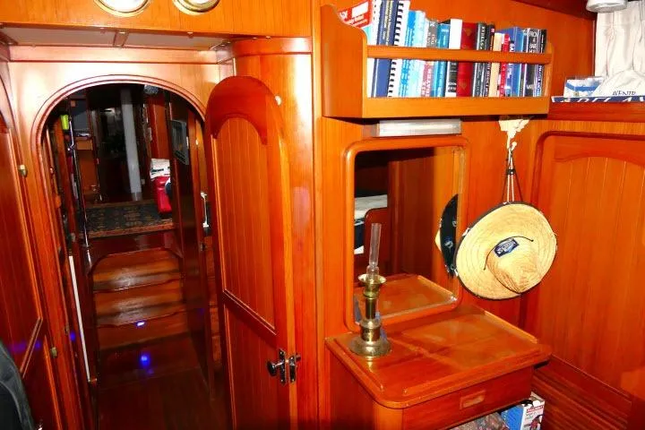 Slide: The Image of 1982 Ta Shing Mason 63 yacht bathroom with sink, mirror, and wooden accents. - 48