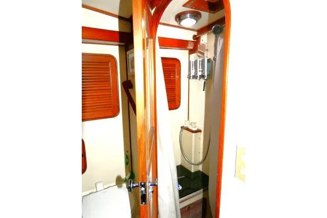 Slide: The Image of 1982 Ta Shing Mason 63 yacht shower with wooden trim and modern fixtures. - 51