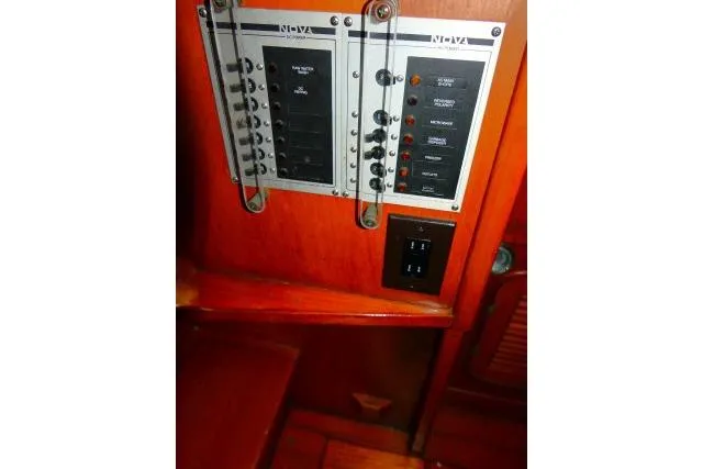 Slide: The Image of Electrical control panel on 1982 Ta Shing Mason 63 yacht, featuring switches and dials. - 58