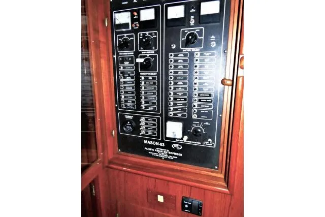 Slide: The Image of Control panel of a 1982 Ta Shing Mason 63 yacht with various switches and indicators. - 59