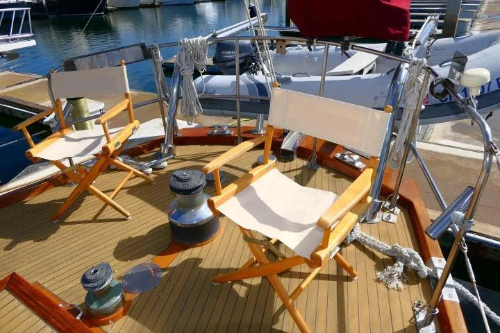 Slide: The Image of Docked 1982 Ta Shing Mason 63 yacht with inflatable boat and Magma grill cover. - 64