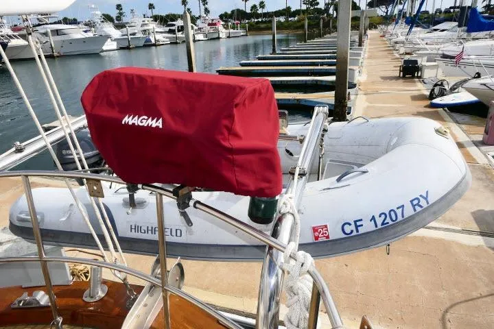 Slide: The Image of 1982 Ta Shing Mason 63 yacht deck with wooden finish and nautical equipment. - 65