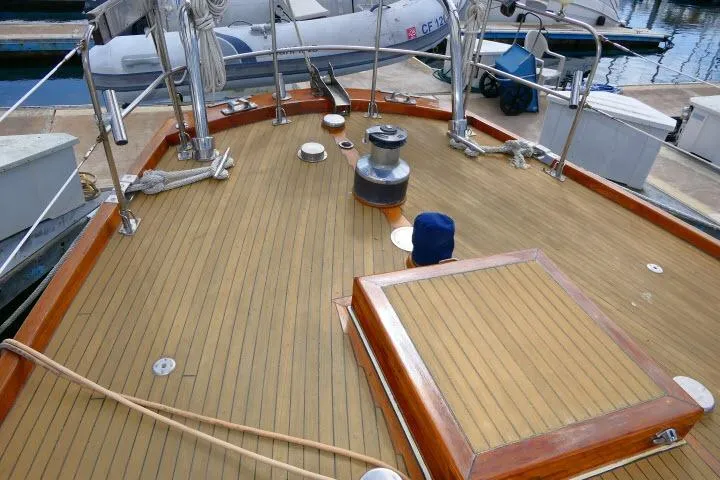 Slide: The Image of Deck of 1982 Ta Shing Mason 63 yacht at marina, featuring ropes and equipment. - 66