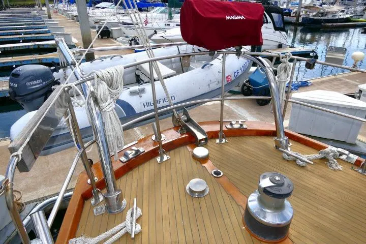 Slide: The Image of Interior view of 1982 Ta Shing Mason 63 yacht with wooden steering wheel and seating area. - 67
