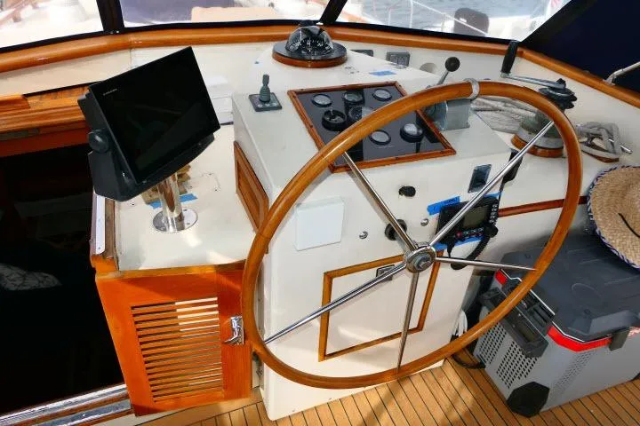 Slide: The Image of Compass on 1982 Ta Shing Mason 63 yacht, featuring a classic wooden mount. - 71