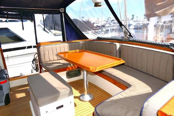 Slide: The Image of 1982 Ta Shing Mason 63 yacht docked at marina, featuring deck and sail details. - 75